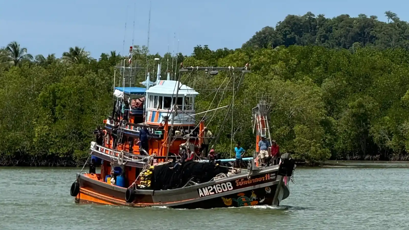 Fishing boat going to pier